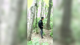 Bad boy jerks while smoking cigarette in a forest - almost caught - so his balls stay full