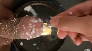 The dog slave burns the cock with wax and tortures the urethra from the inside