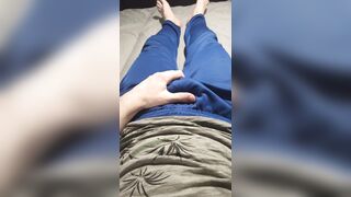 A fellow in blue sweatpants touches his swelling