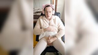 Ultra-cute in armchair and milky miniskirt