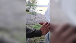 Inhaling big salami outdoors