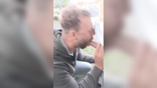 Inhaling big salami outdoors