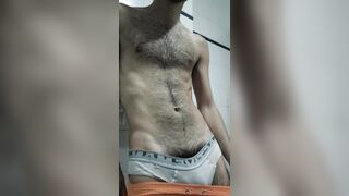 Mexican hairy man takes tee-shirt off and showcases his warm pubic hair and unshaved six pack