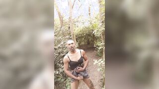 Ebony spunk face BIG BLACK COCK sissy fuckslut fellow outdoors in the forest dressed in underpants and mini-skirt and spunks.