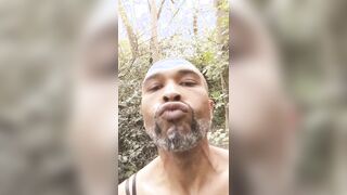 Ebony spunk face BIG BLACK COCK sissy fuckslut fellow outdoors in the forest dressed in underpants and mini-skirt and spunks.