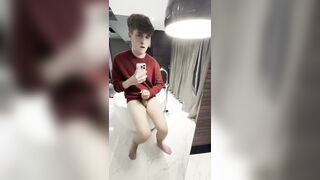 Youngster with phimosis jerks in tub