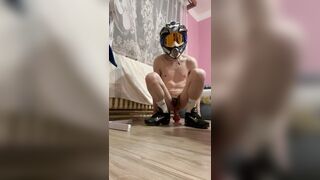 A locked-up fellow in a helmet plays with his fucktoy and loves it in total movie