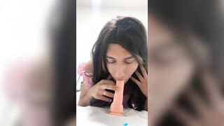 Natalia Valera uses her gullet to put a protection on her fake penis and rails it