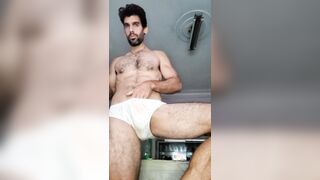 Wooly muscled guy milking off and jiggling powerfully