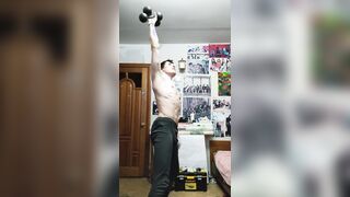 A warm sport professor does a home exercise and poses with a marvelous figure