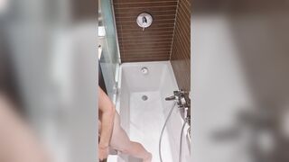 A fellow takes a douche in a motel apartment