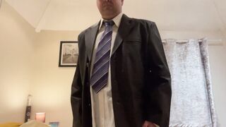 Leather suited disrobe nude