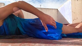 Doing workout in semi-transparent sundress in a public place