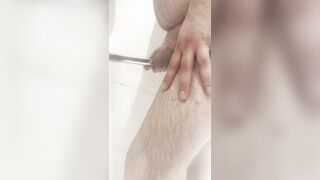 Water runs down a ginormous grizzlys smallish dick