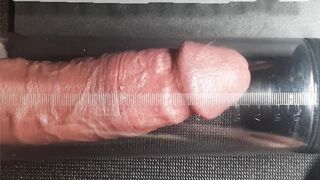 Close look of a Man attempting a manhood pump.