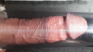 Close look of a Man attempting a manhood pump.