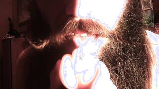 dude with facial hair eating coochie