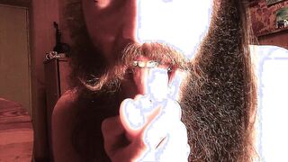 dude with facial hair eating coochie