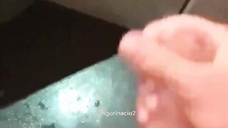 Stroking off in the douche at the beach