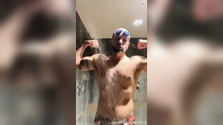 Bearded Swimmer showers in locker guest room