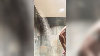 Bearded Swimmer showers in locker guest room