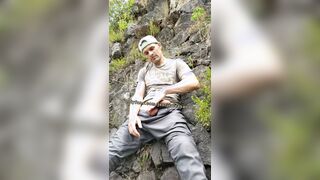 Showcasing off ginormous man sausage outdoors in nature