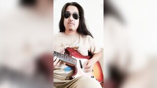 Loosened palms brush lips while guitar inflames fellate fantasies