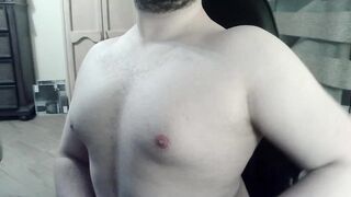 Bulky camboy ripples his muscled torso and palms