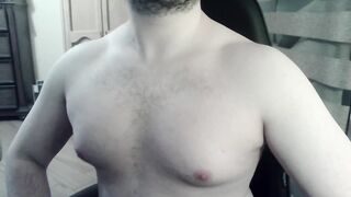 Bulky camboy ripples his muscled torso and palms