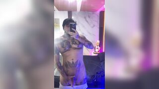 Yekous jerks in front of the mirror