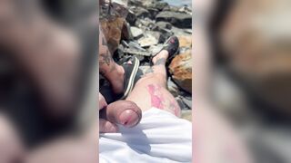 Parent plays on the river with his spear
