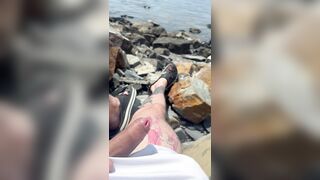Parent plays on the river with his spear