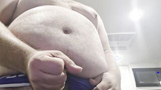 Giant abdomen dude plays with himself