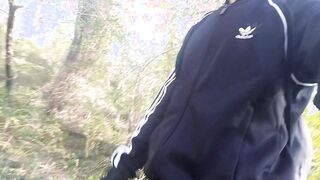 Freeballing in public, this twunk ambles outdoors commando, no undergarments underneath his ebony adidas track trousers, Campus sneakers, while out queer cruising