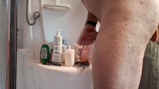 Heating up my pucker in the douche with a immense faux-cock