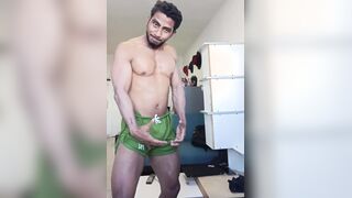 Dark dark-hued bodybuilder ripples his large muscles and gets bare