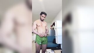 Dark dark-hued bodybuilder ripples his large muscles and gets bare