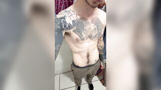 Furry tattooed lean man