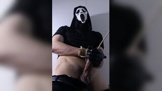 Ghostface-hooded roped up fapping in dungeon space