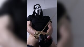 Ghostface-hooded roped up fapping in dungeon space