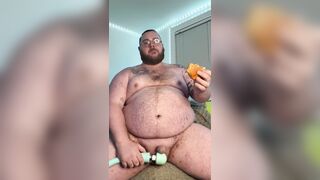Piggy plays with plaything & gobbles burger