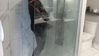 Orca toying with knob in motel bathroom