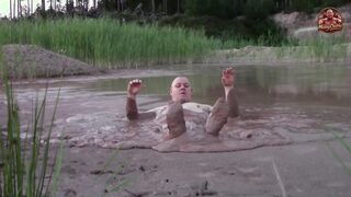 Dirt bathtub in deep quarry mess pond