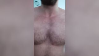 Beefy stud bodybuilder is showcasing his muscle and jack