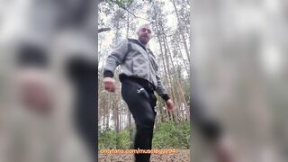 muscled fellow bodybuilder is jerk in woods