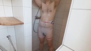 Managed boy showers in see-through singlet