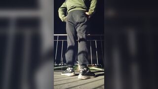 Plunging his cock out and showcasing his butt on the road.