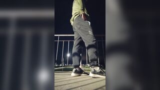 Plunging his cock out and showcasing his butt on the road.