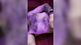 Nughty Guy drains with his soles in the air, showcases off his fur covered culo and blows a load on his own face