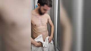 Fellow takes a douche and lathers up his half-swell meatpipe